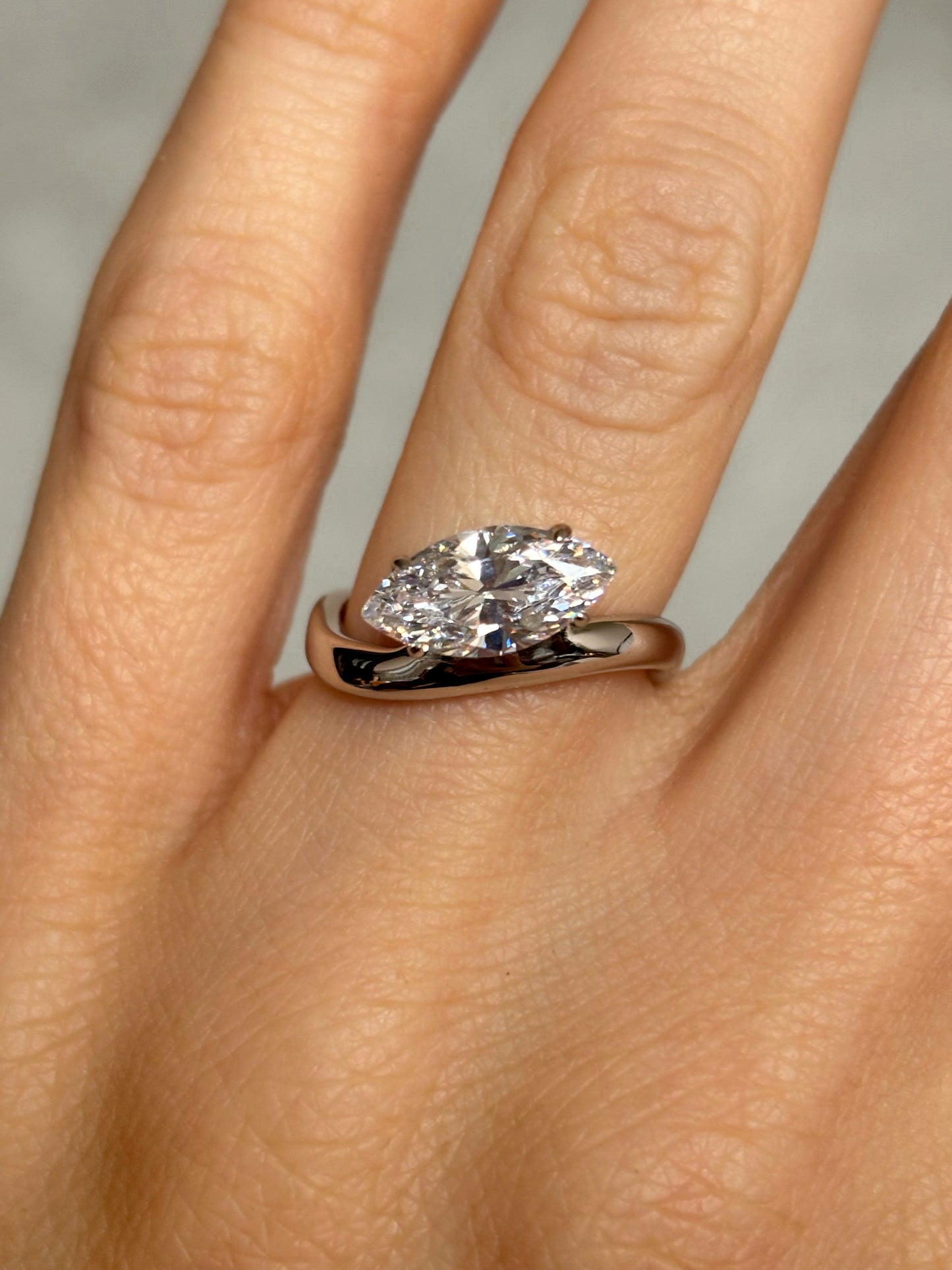 Marquise stone ring with curved band