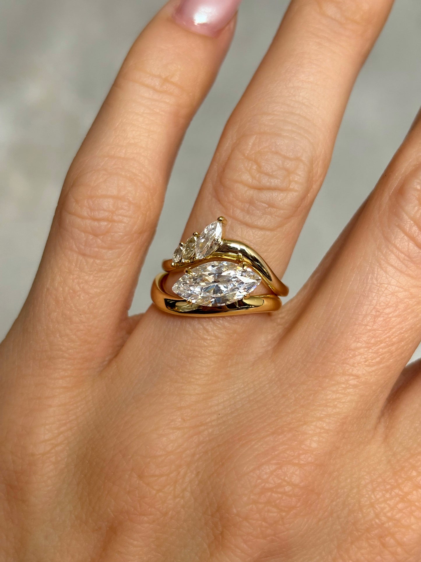 Marquise stone ring with curved band