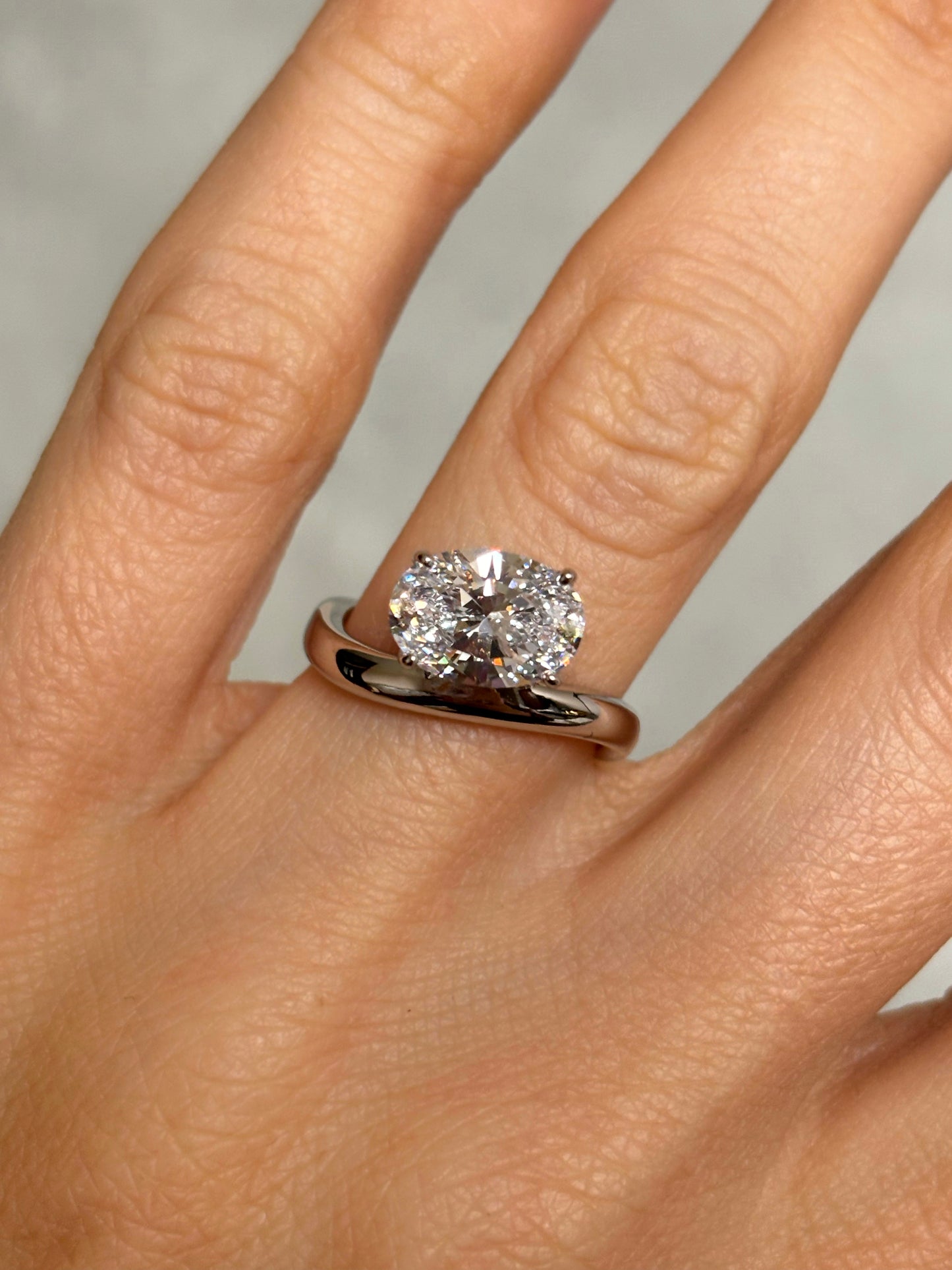 Oval stone ring with curved band