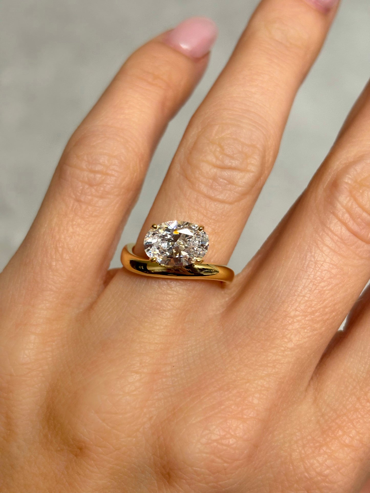 Oval stone ring with curved band