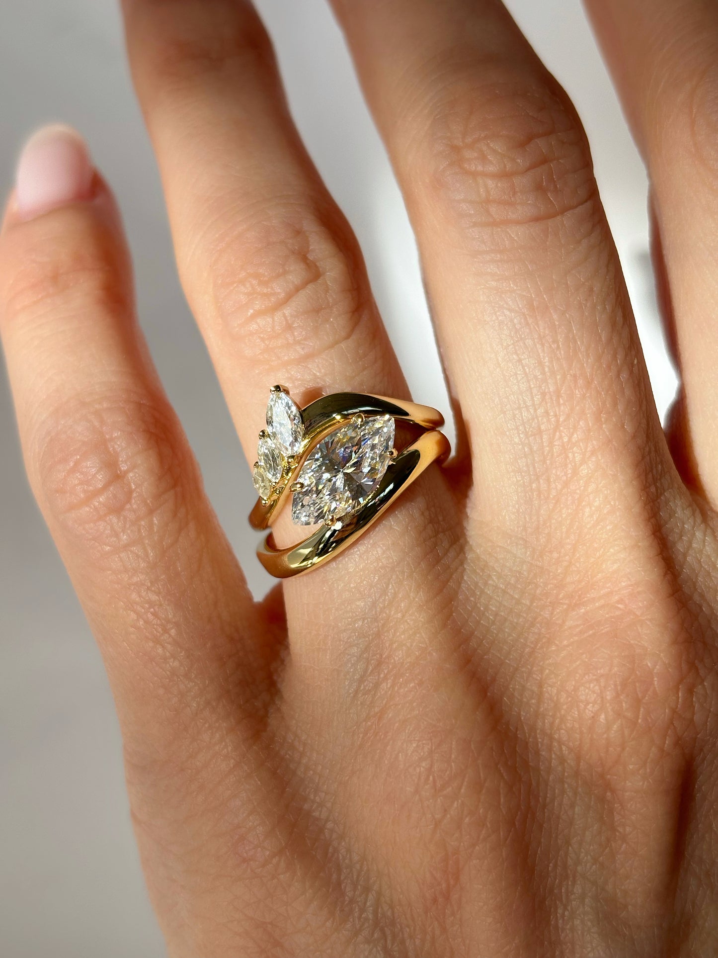Curved band with marquise stones