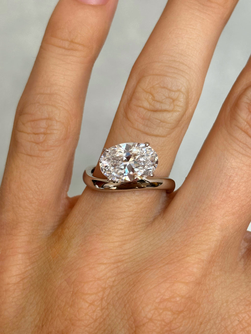 Oval stone ring with curved band