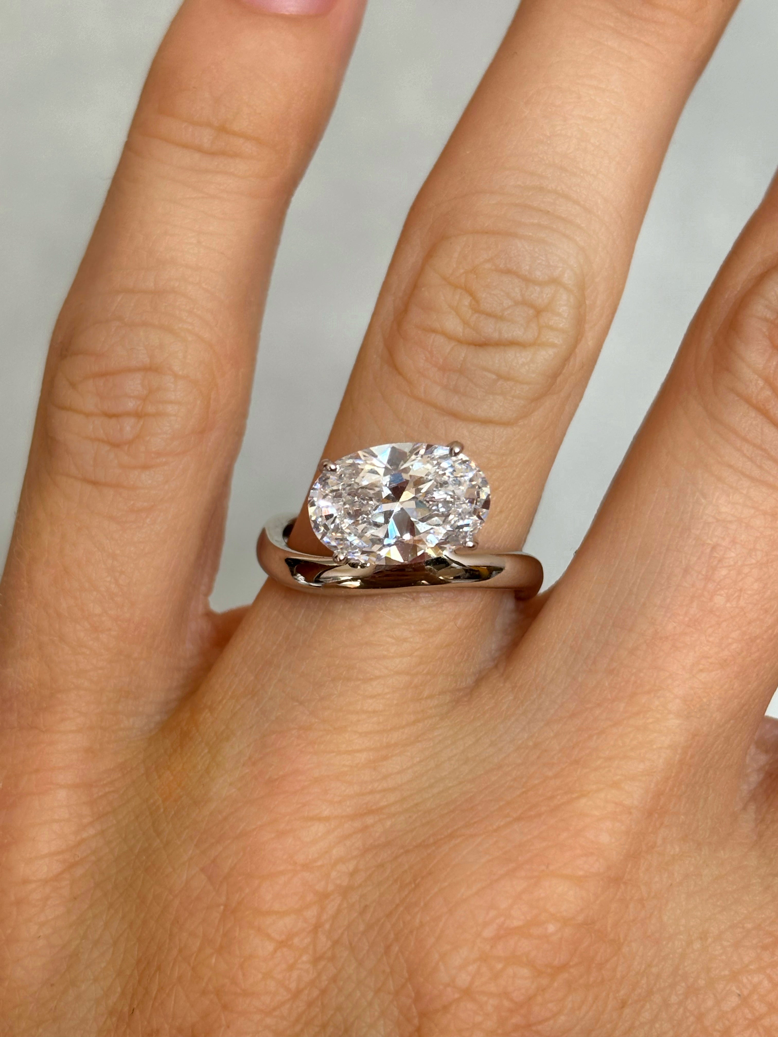 Oval stone ring with curved band