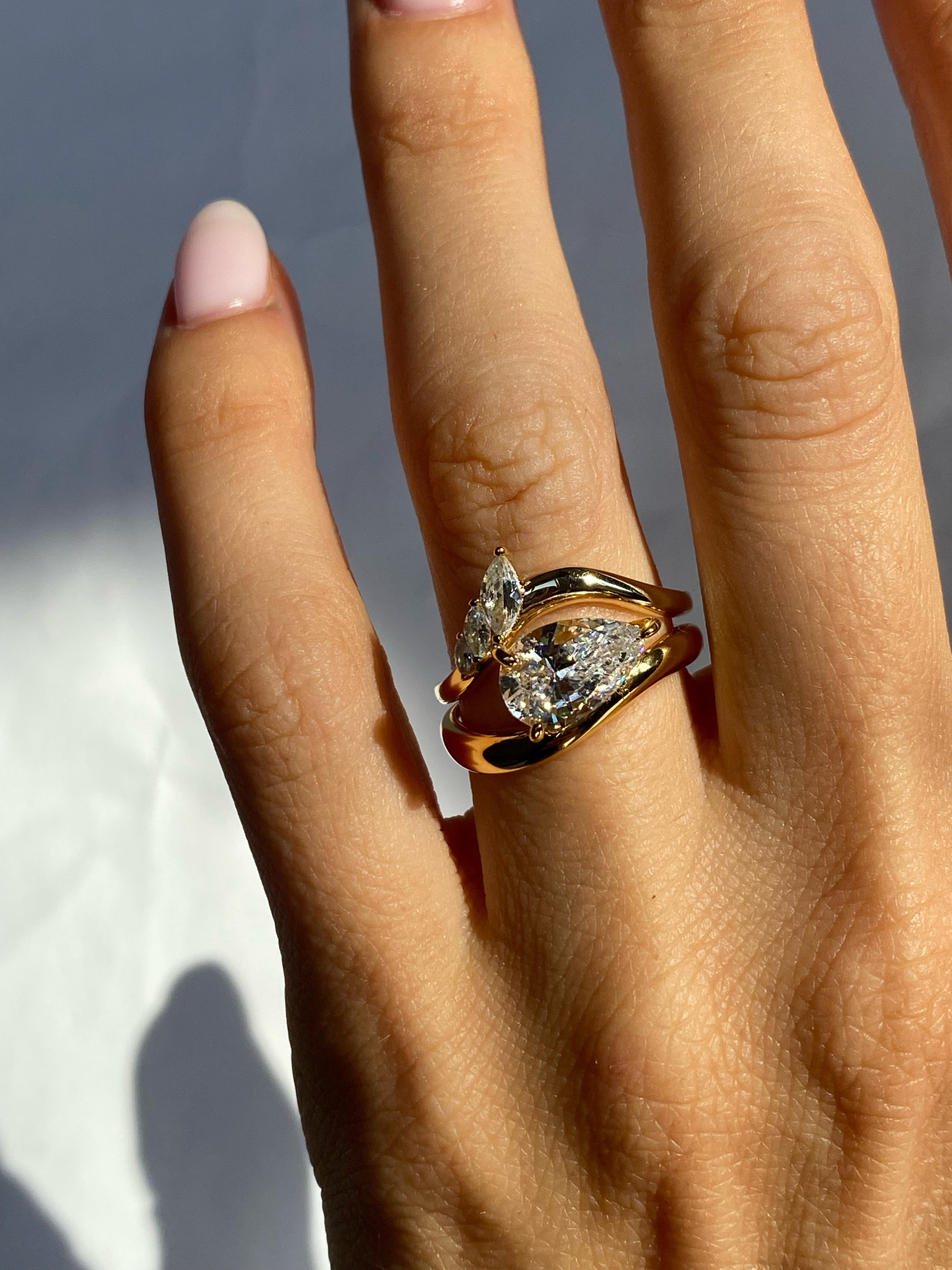 Curved band with marquise stones
