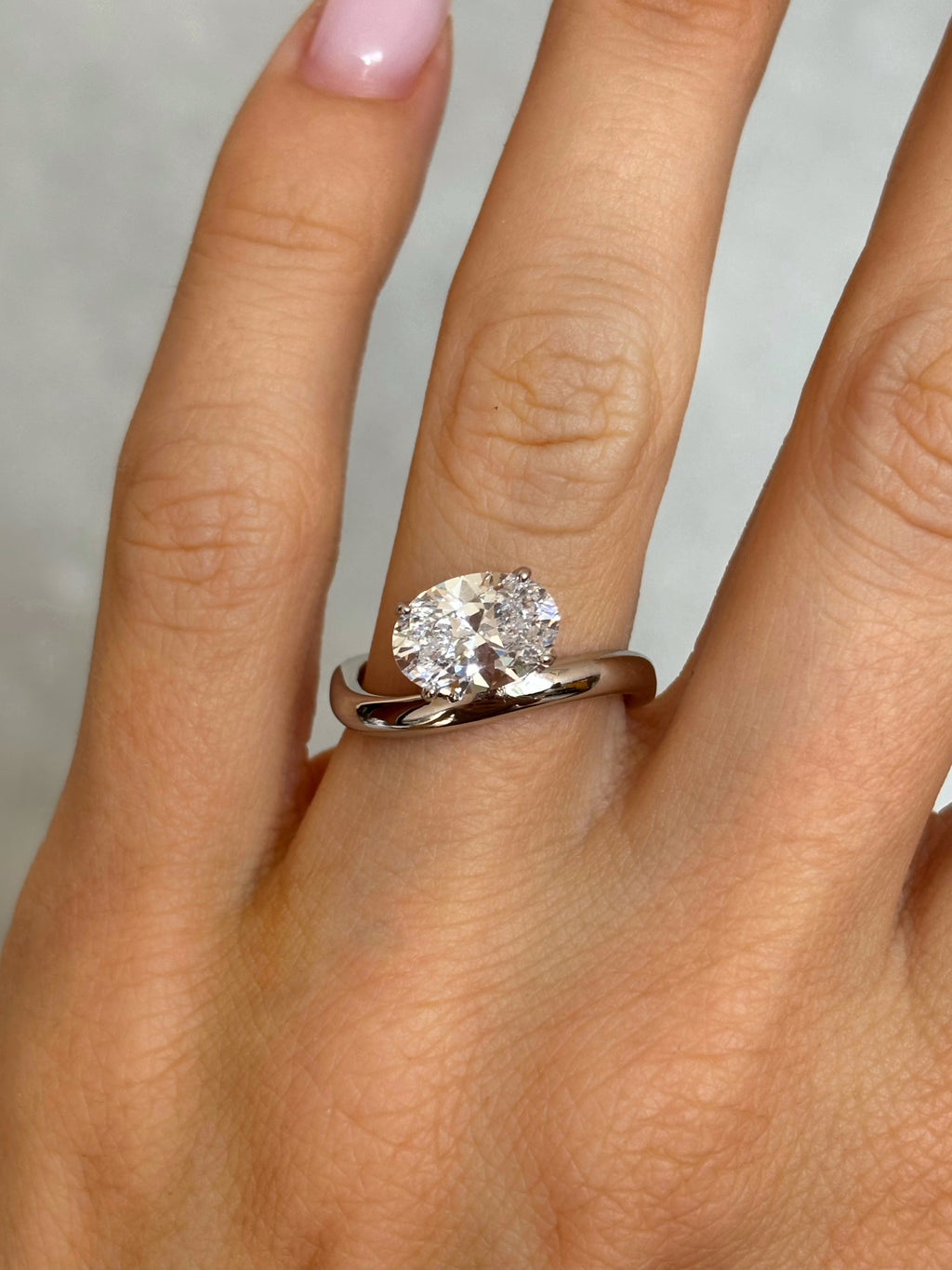 Oval stone ring with curved band