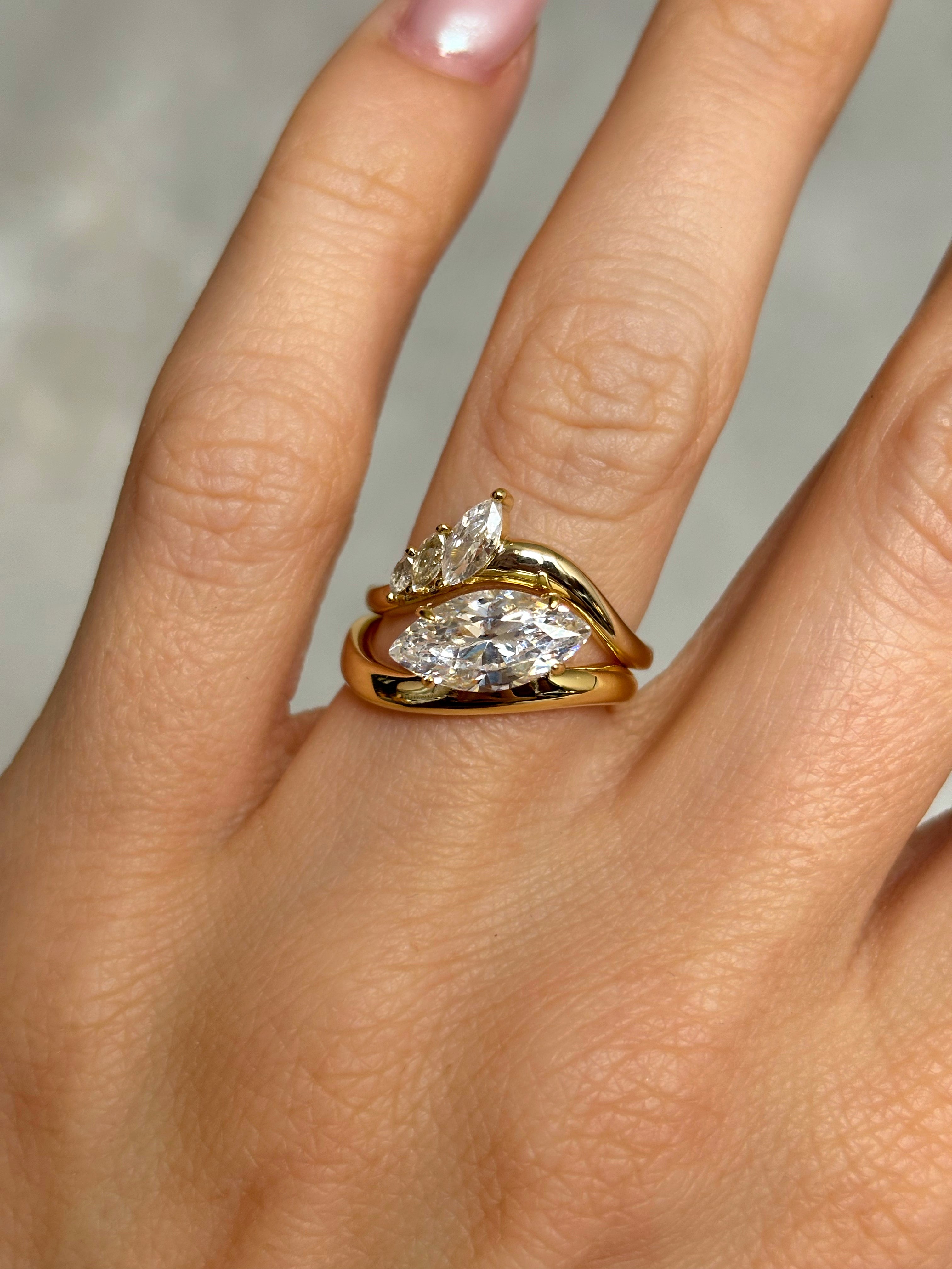 Marquise stone ring with curved band