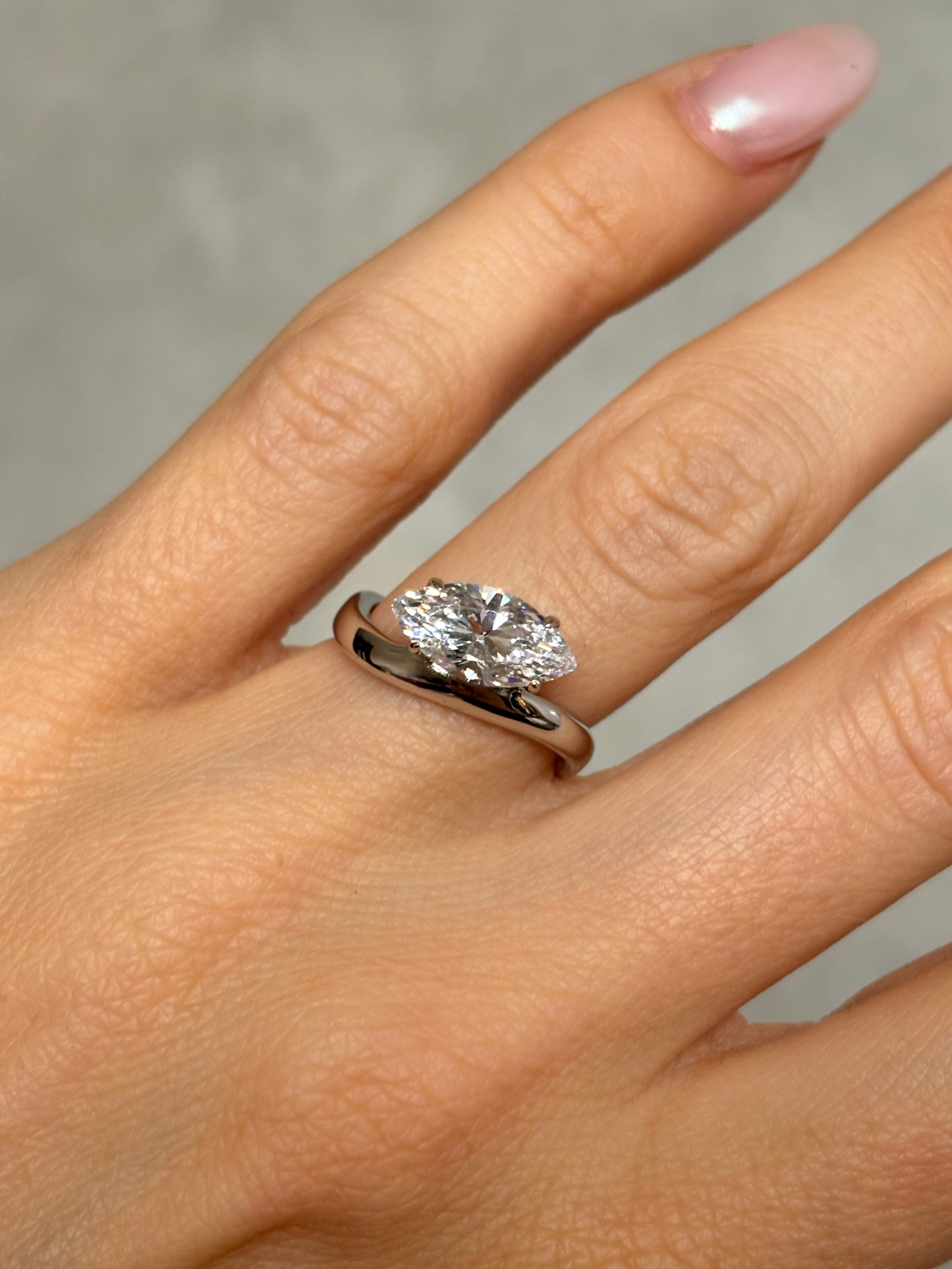 Marquise stone ring with curved band