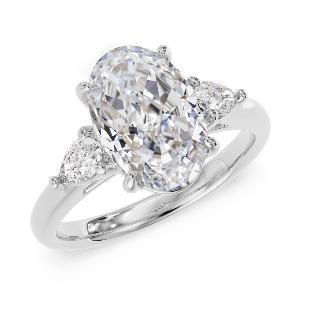 Oval stone ring with pear-cut side stones