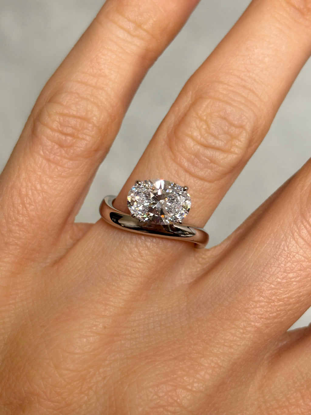 Oval stone ring with curved band