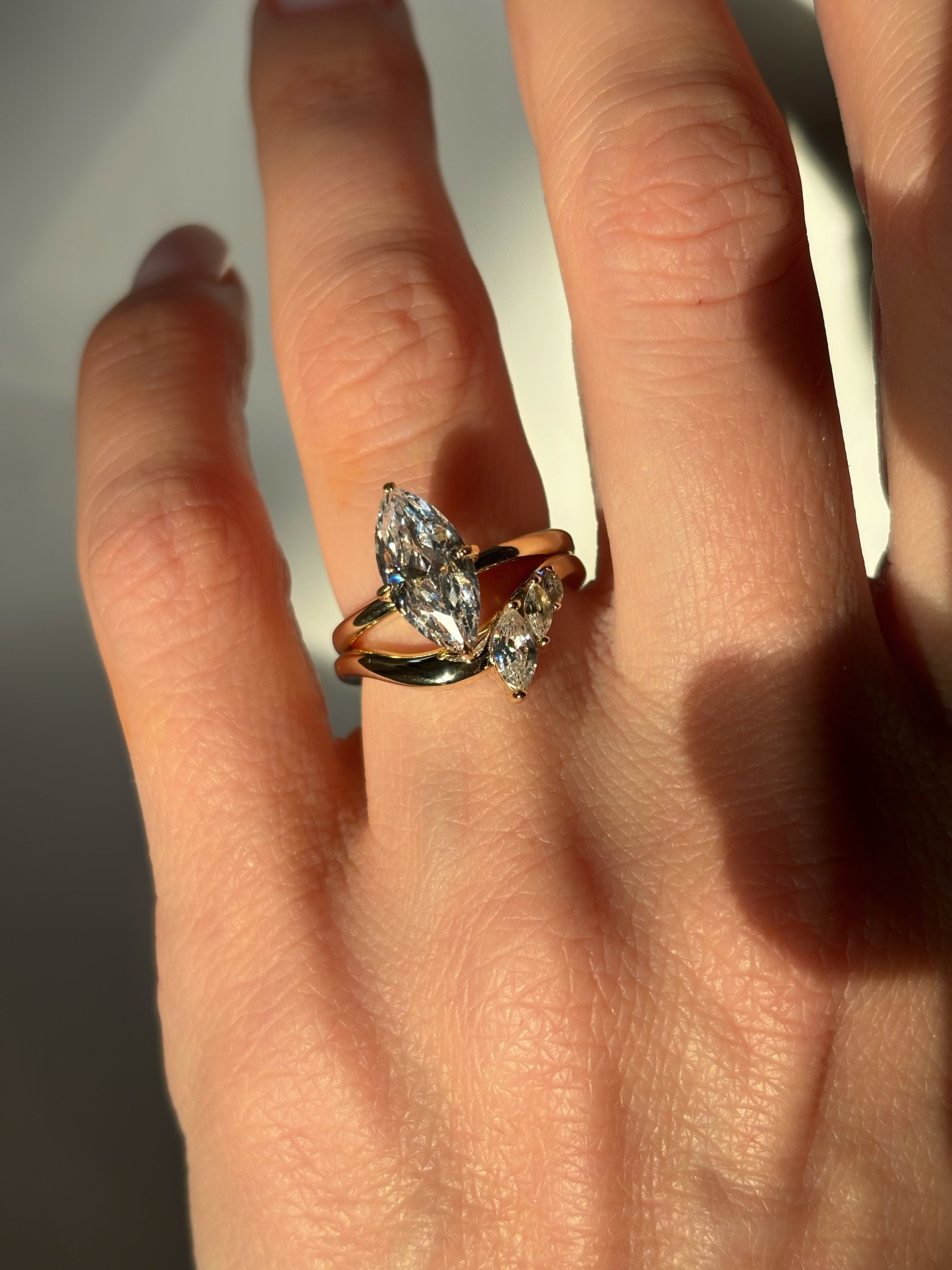 Curved band with marquise stones