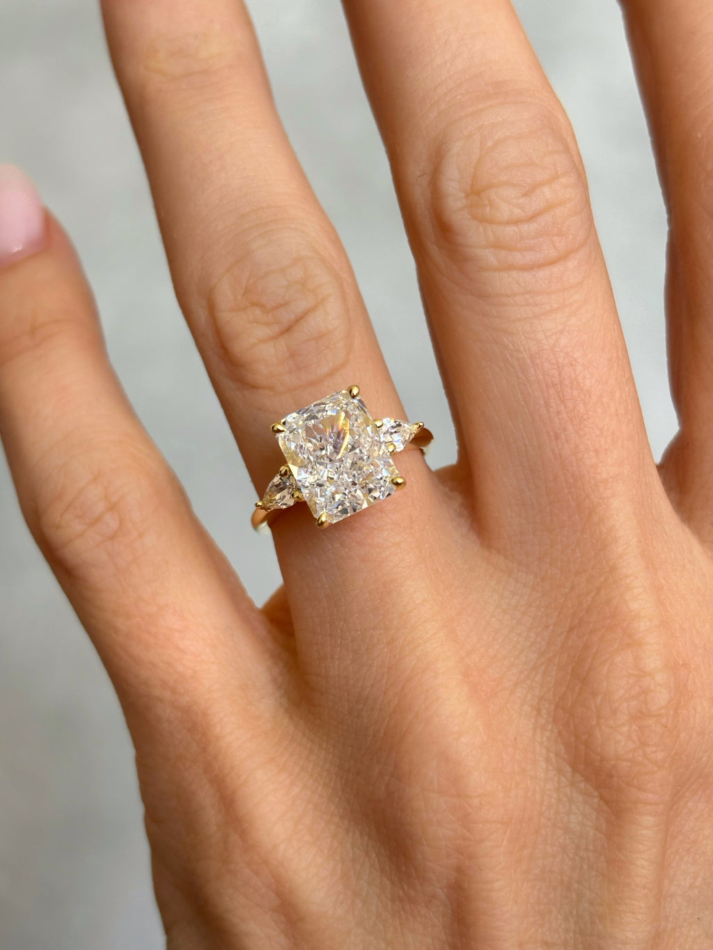 Radiant-Cut ring with pear-cut side stones