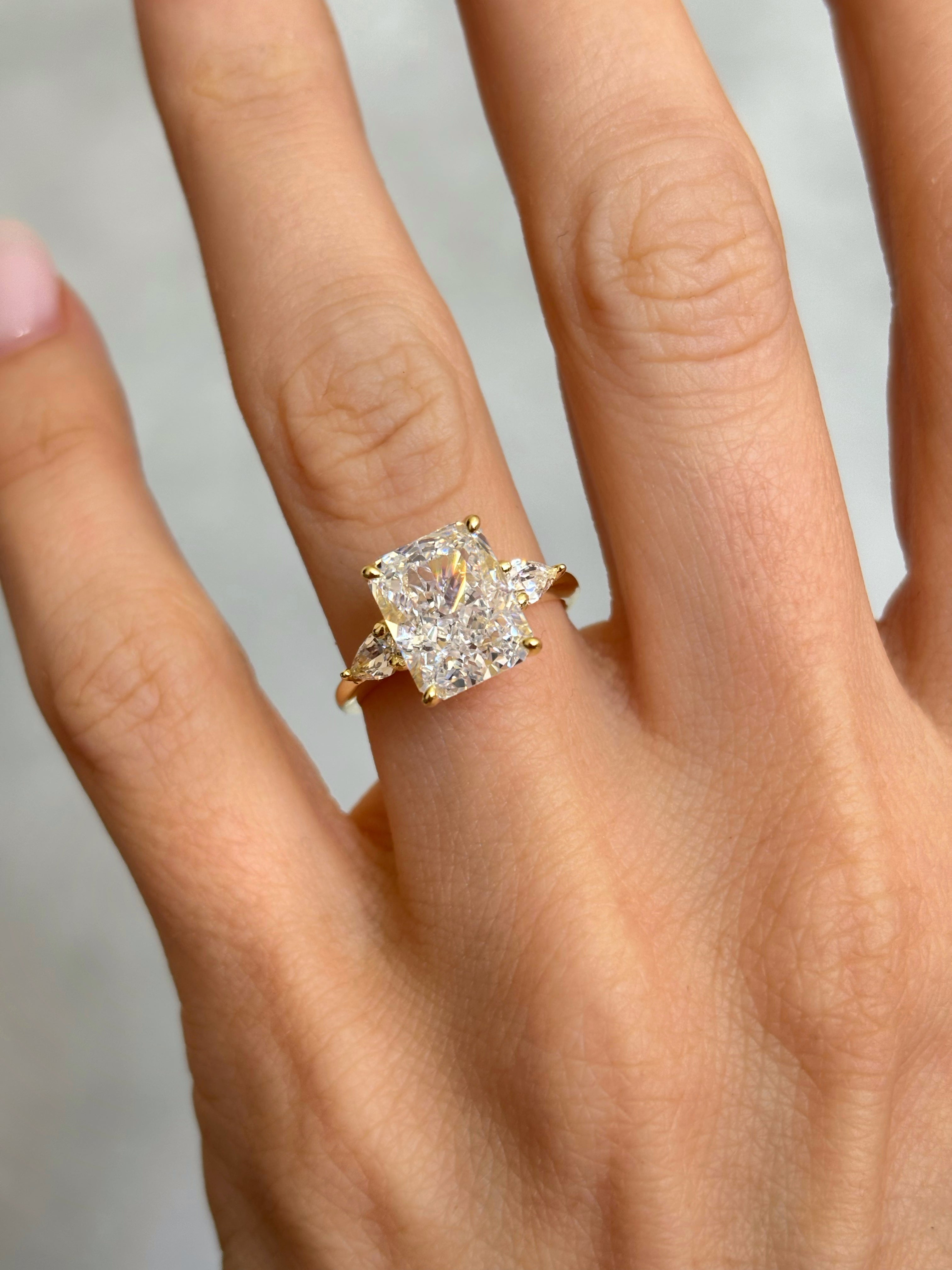 Radiant-Cut ring with pear-cut side stones