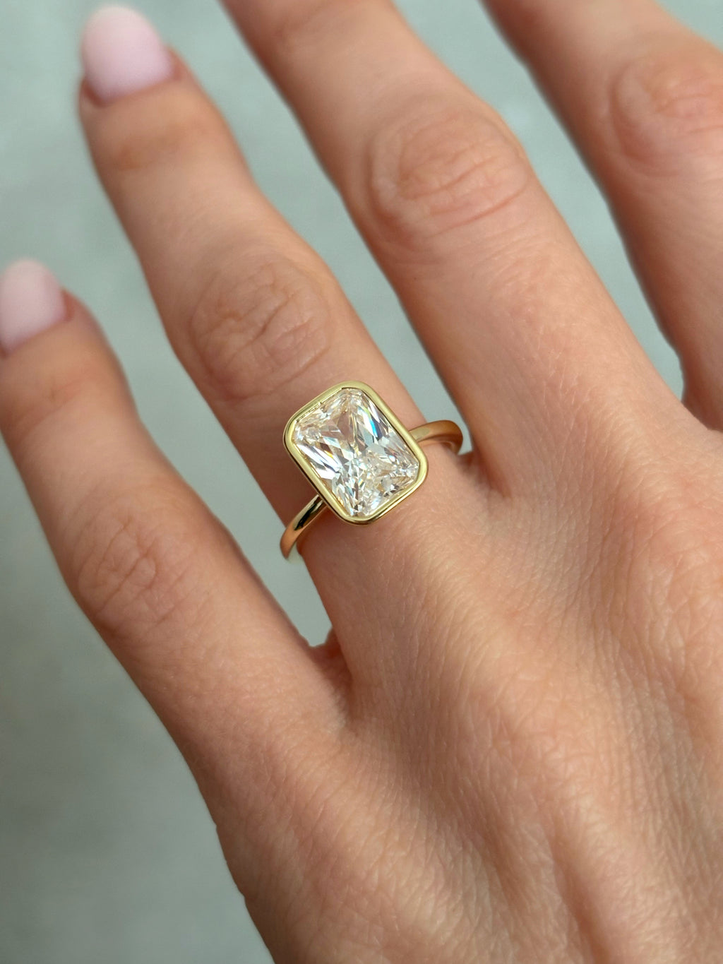 Bezel set Radiant-cut ring
