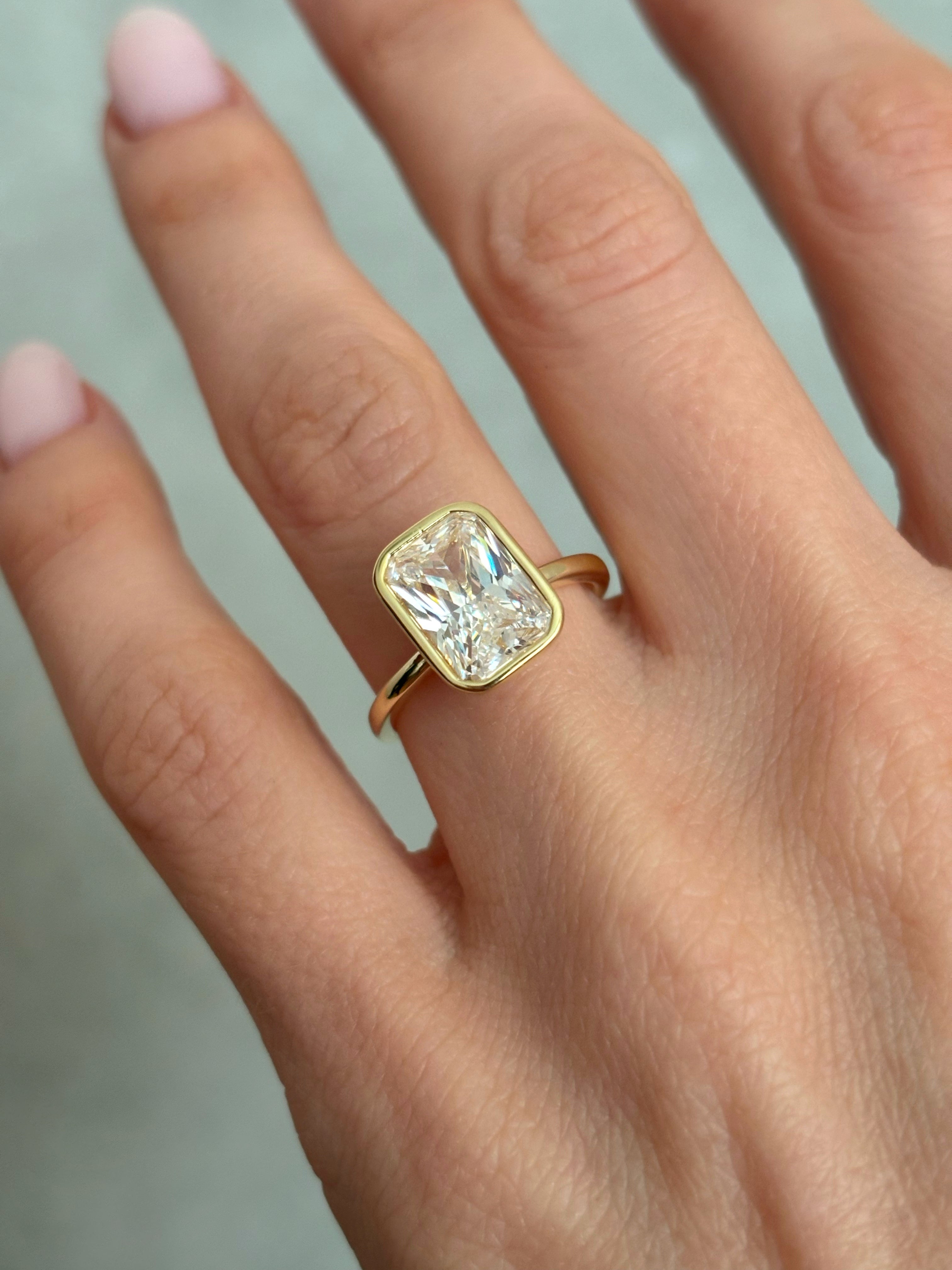 Bezel set Radiant-cut ring