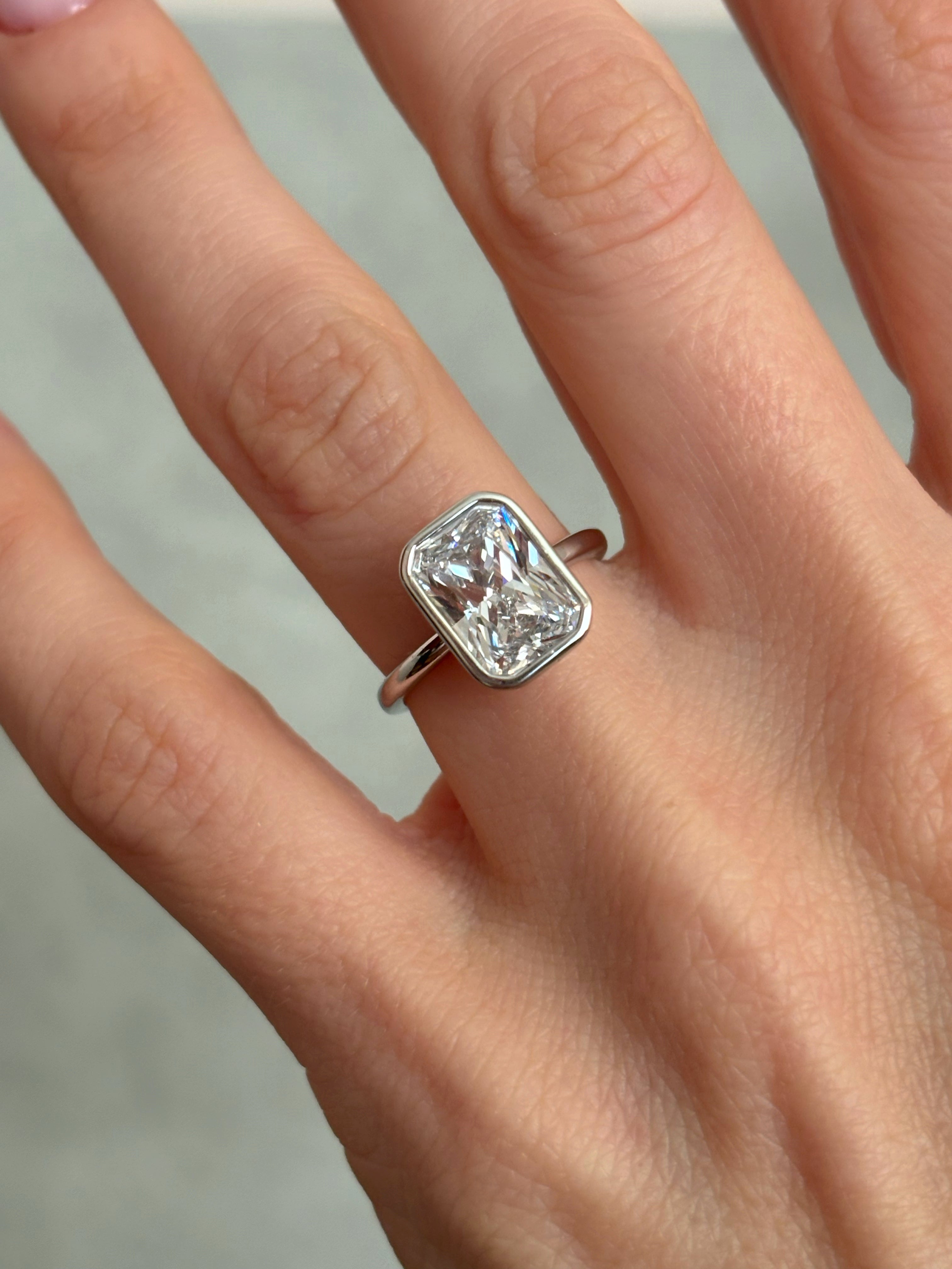 Bezel set Radiant-cut ring