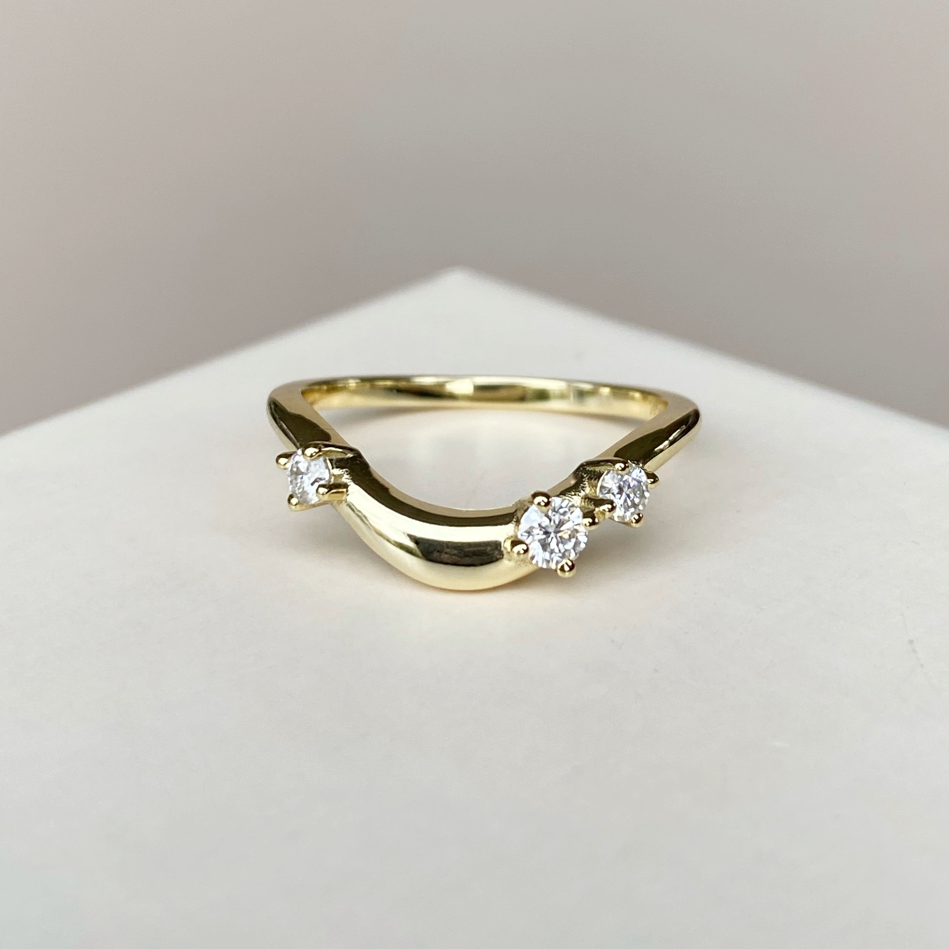 Curved band with round stones