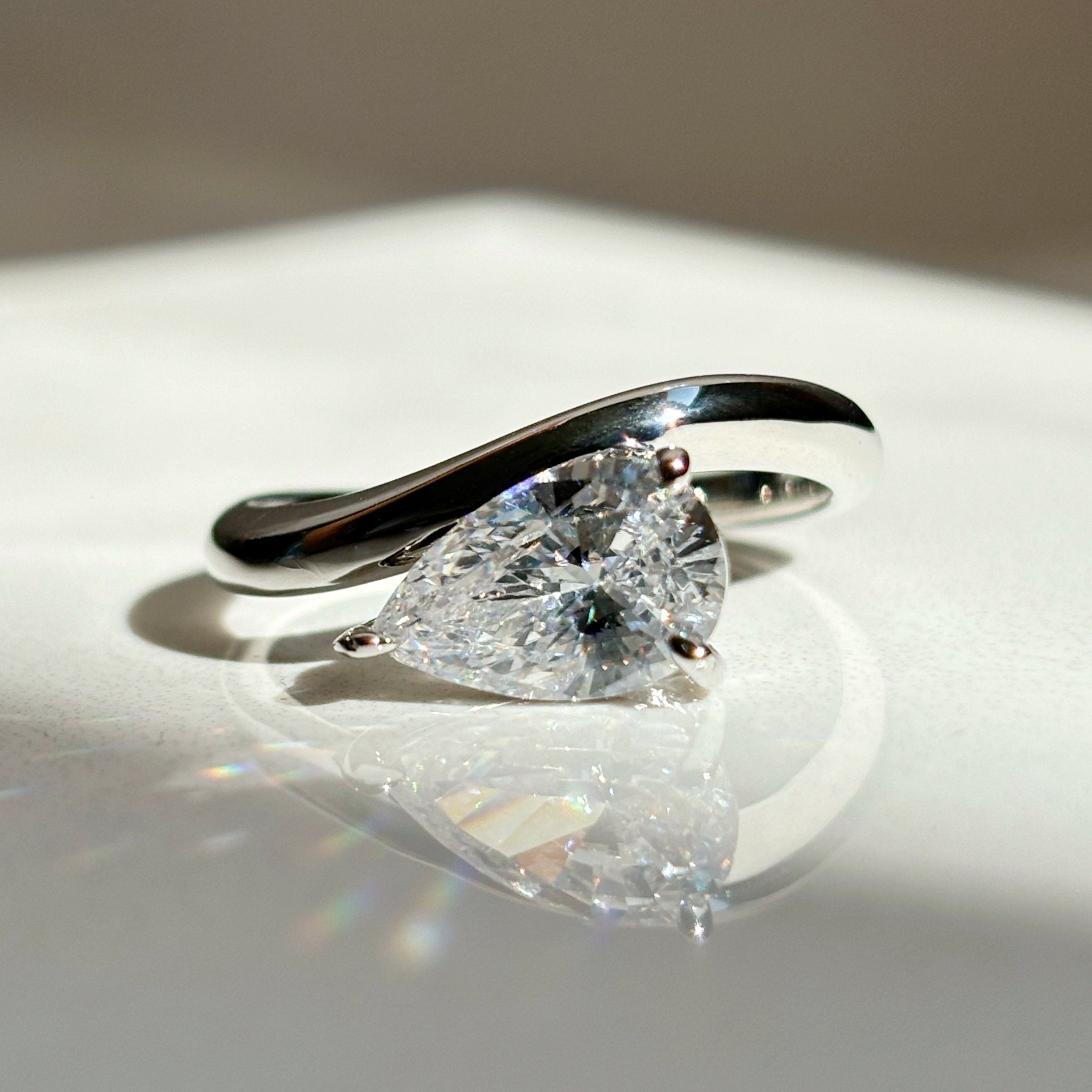 Pear stone ring with curved band