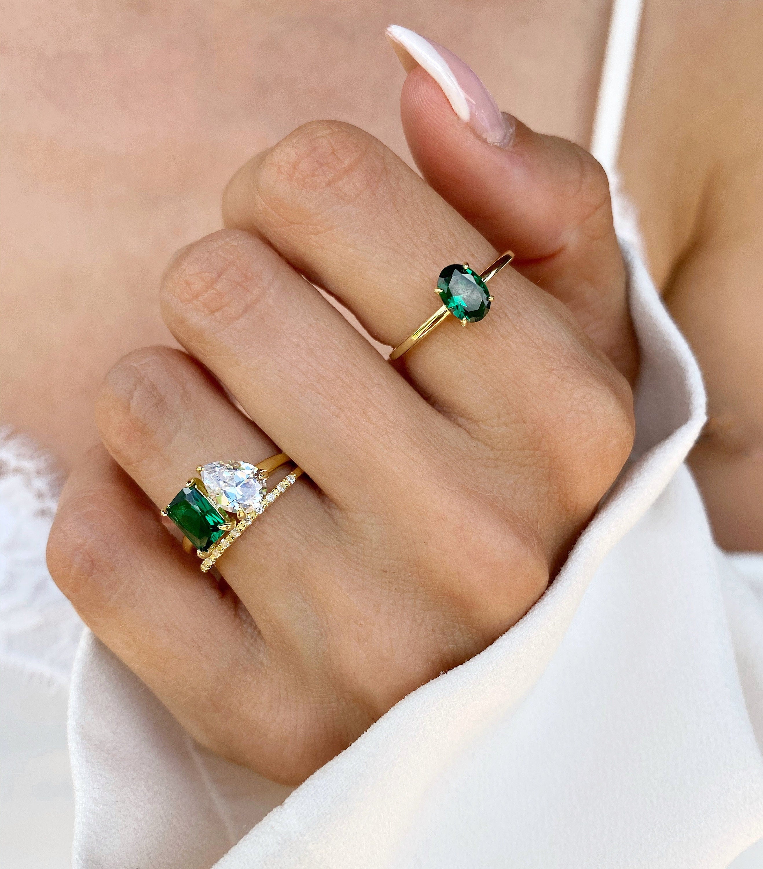 Double emerald clearance ring